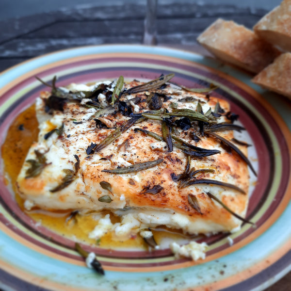 Melting feta with rosemary and lemon thyme.